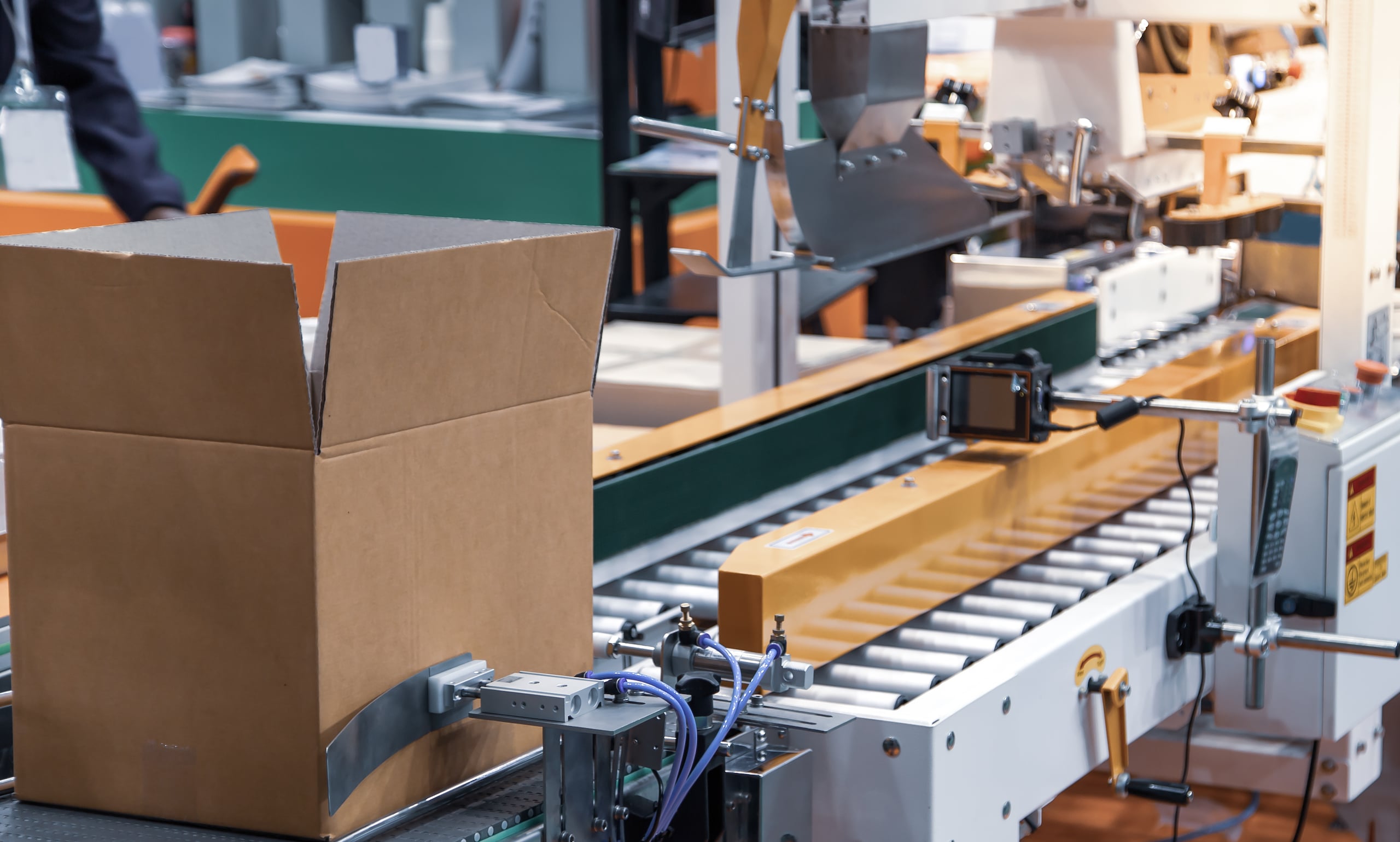 Bar code label scanner. Box identification with bar code scanner in modern industrial warehouse