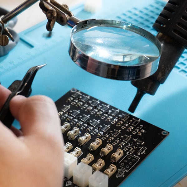 TLMoto soldering a board